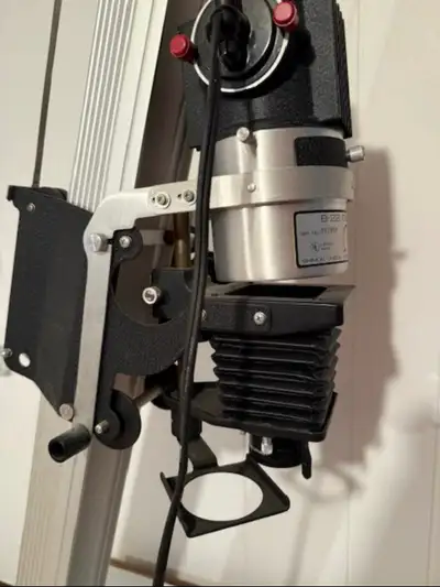 Darkroom (film photography) equipment. This is an Omega B-22 enlarger with two lenses and carriers.