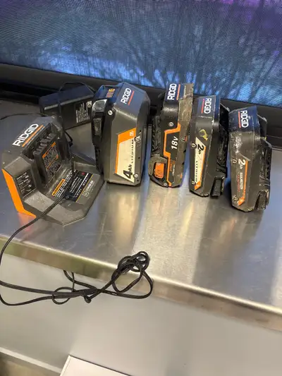 4 rigid batteries and charger , View more