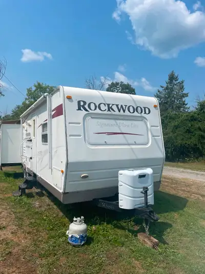 Trailer for Sale As Is. $4500.00 2009 Rockwood with two slides, full washroom with an outside shower...