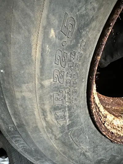 11R22.5 STEER TIRES, 2 tires one on a rim, both have lots of tread, 1 Dunlop, 1 BF Goodrich PRICE $2...