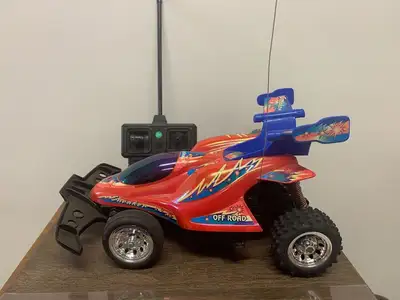 Vintage (early 2000s) RadioShack 'Sneaker' R/C car, with remote, original box, and instruction manua...