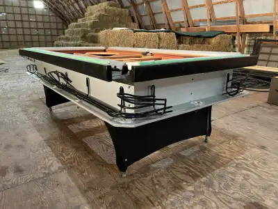 7'6" L X 4'3" W X 30.25" H This is a unique customized bar-size table with exposed ball return rails...