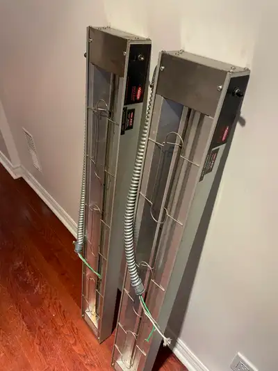 Pair of heat lamps for sale, both work, new and never been used yet, they run off 120v , 1100watts ,...