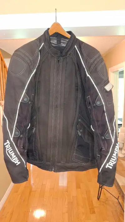 3 in one Triumph motorcycle jacket. Has rain liner and full sleeves quilted liner. Removable panels...