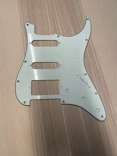 This Strat style pickguard is new featuring an HSS pickup configuration, designed for guitar modific...