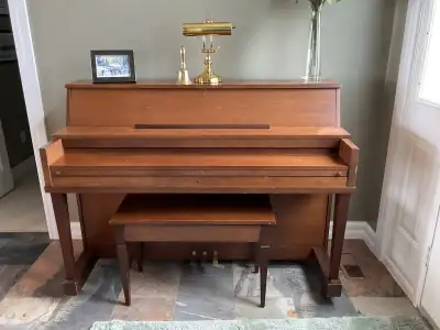 Much loved piano. Mechanisms intact. Sound is good. Tuning will be needed. Specs: 56” wide, 42” high...