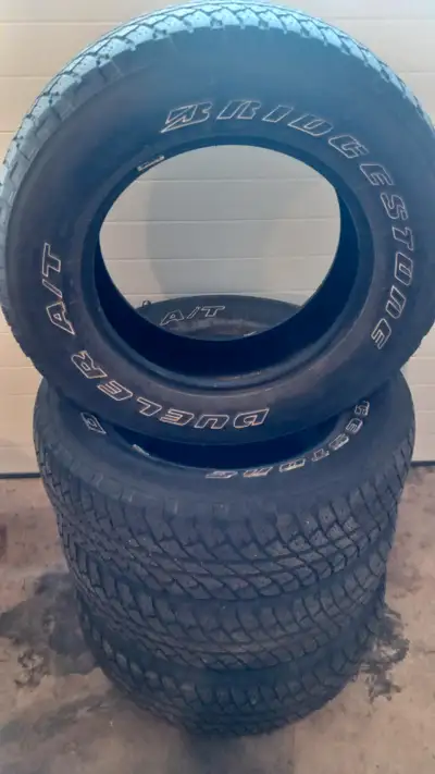 4 -- 255/70R18 BRIDGESTONE DUELER A/T tires for sale. These tires are in very good condition with lo...
