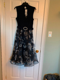 Ladies size 8, new dress by Joseph Ribkoff.  Price is negotiabl!
