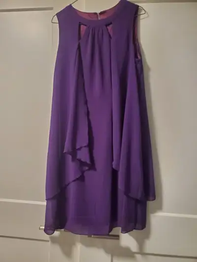 Beautiful purple mid length dress. Size 4-6 but could fit size 8. Never worn. Excellent condition.