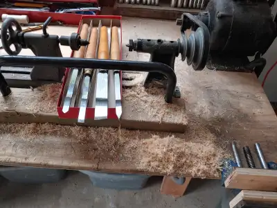 Lathe with wood turning tools., View more