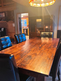 Oak table and matching hutch , Brand New black Chairs.