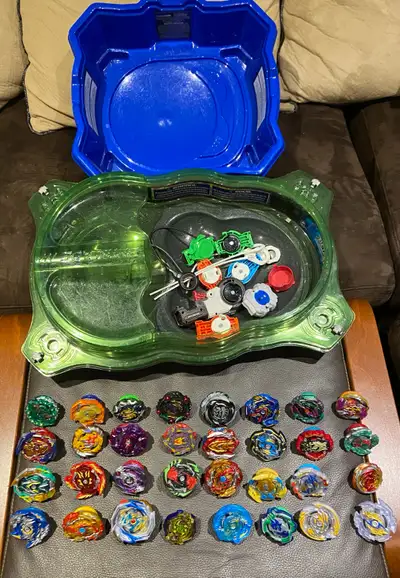 32 Beyblades Several launchers Two Stadium All together only. Price is firm!