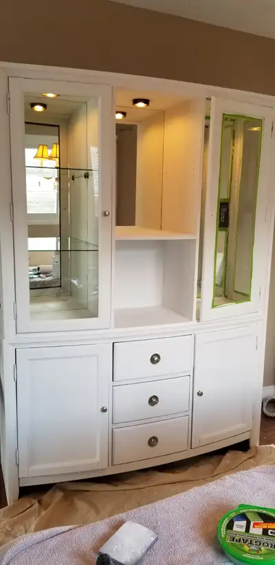 Solid wood hutch in white with glass doors and shelves. Doors and shelves have been removed to make...