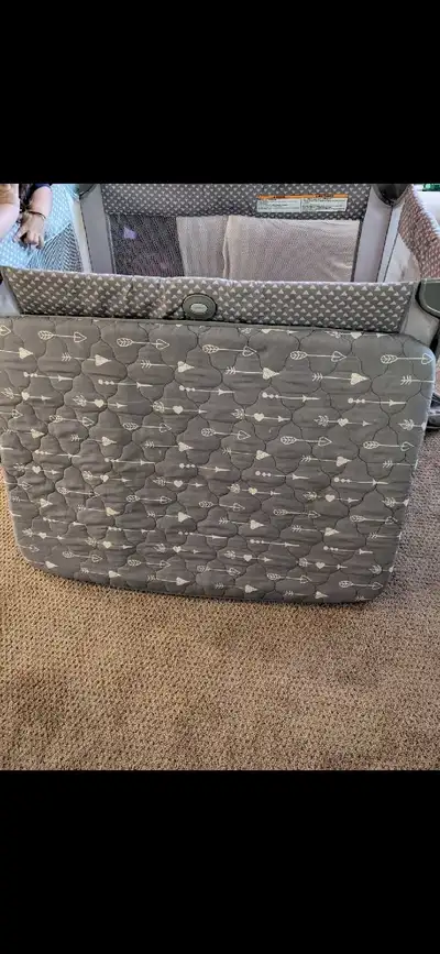 I'm selling a Graco Pack N Play, which is in used but good condition and includes an added mattress...