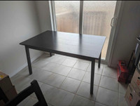 IKEA black dining table seats six- no chairs