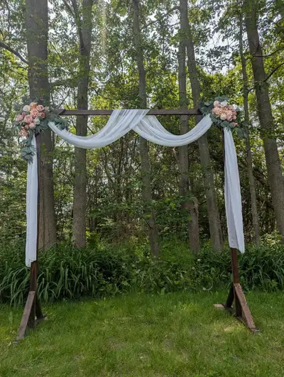 Used once for our wedding, then disassembled. Includes the flowers and drapes.