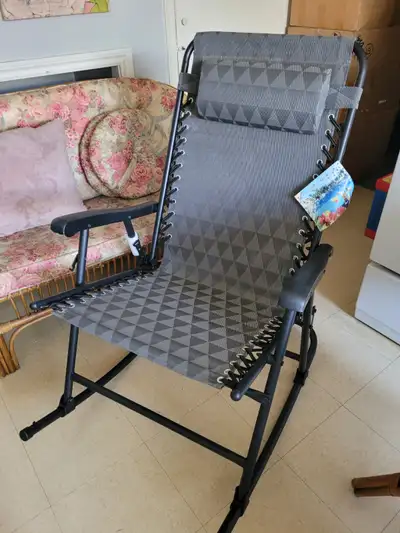 Brand new zero gravity rocking chair., View more