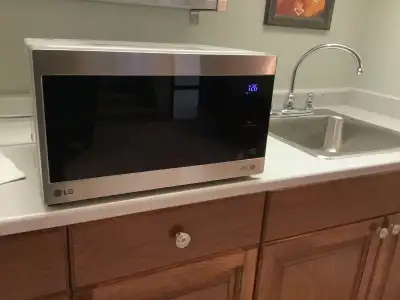 LG Counter Top Microwave- Compact design. 10.75” H x 18.5” W x 14.5” D. Still new, used 10 times. Bl...