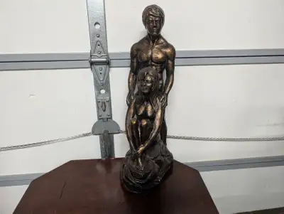 Plaster cast statue in faux bronze color. Large table top art piece. Heavy and solid cast piece. Has...
