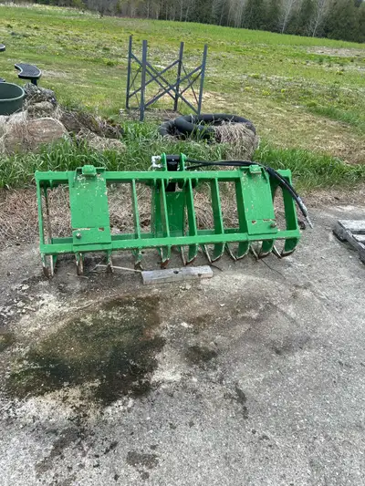 66” root rake grapple by HLA. Used on a John Deere 3520. Included are hoses to connect to rear remot...