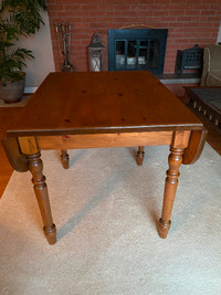 Dining table, with folding side panels