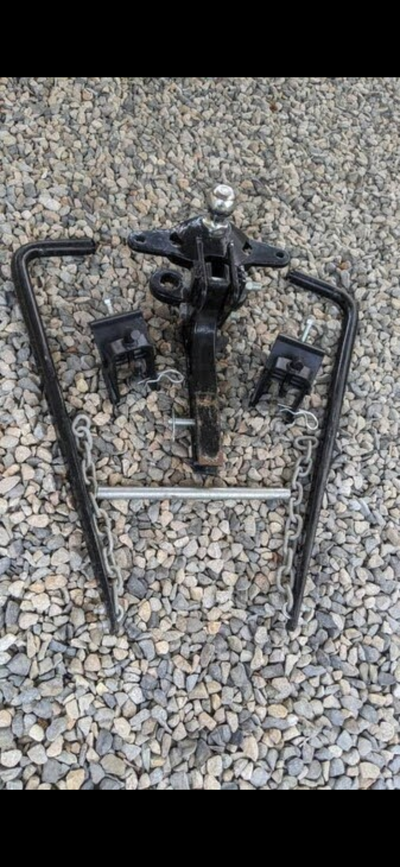 Fully adjustable equalizer hitch with 2 5/16 ball, only used twice, 15,000 pound tow rating. New $60...