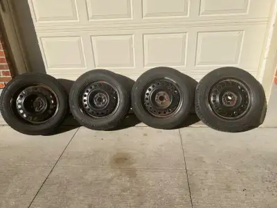 For sale: Set of 215/65R17 Michelin X-Ice snow tires on 17 inch steel rims. Bolt pattern is 5x112 of...