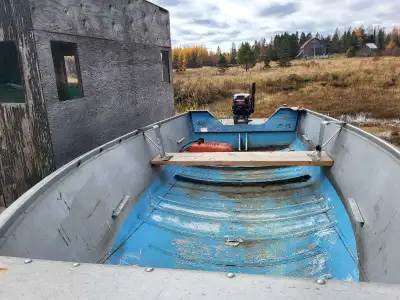 14' deep and wide boat with 15 HP 2 stroke Mercury. Motor runs great, boat seats were removed to bui...