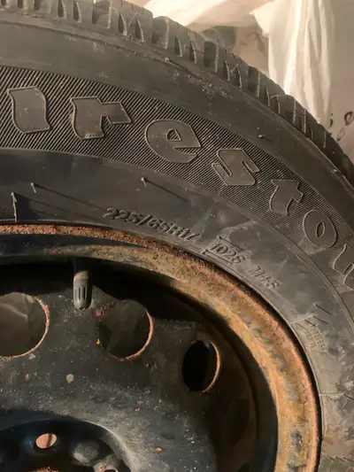 4 -225/65/17 Firestone tires on wheels used 1 winter in excellent condition with 2 sets of hubcaps t...