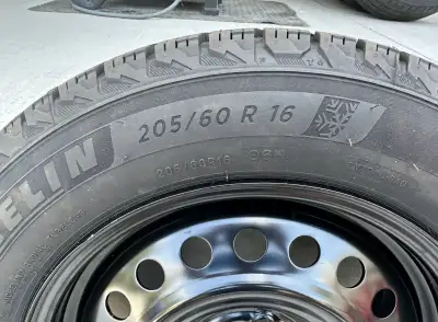 One brand new tire. Other 3 have less than one full winter season on them. Been in storage since