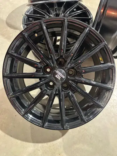 4 brand new black wheels including center caps. 17”x7” 38 offset 66.1 hub bore 114.3 X 5 spacing.