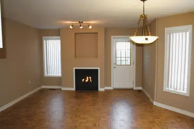 The townhouse features an open concept main floor with kitchen, dining and living room space with a...