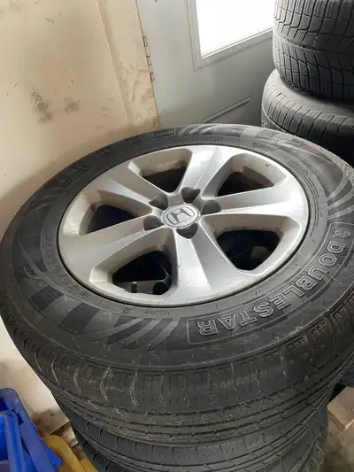 4 tires with Alloy Rims. Only used for 3 months. All Season. 235/65R17 bolt pattern is 5X120 from Ho...