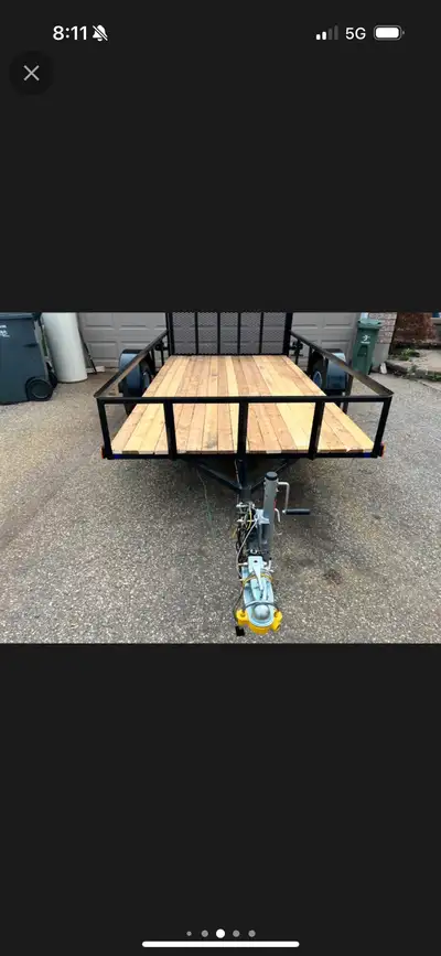 This utility trailer is perfect for hauling equipment and materials, featuring treated wood floors f...