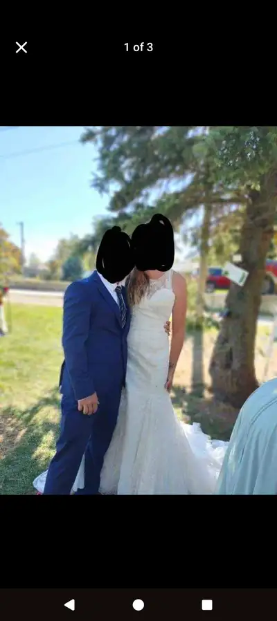 Size 14 wedding dress. Only worn for like a hr. Retails for over 1400$. Beautiful buttons on the bac...