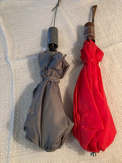 2 umbrellas, red and gray. Please see photos.
