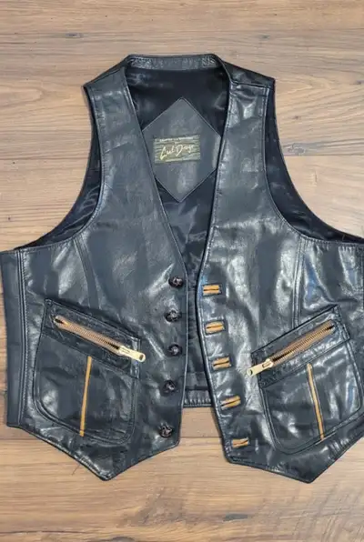 Men's handcrafted leather vest by Carl Drago. In good condition and well made. Size is small-medium...