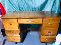 Antique wooden desk with deep drawers for storage