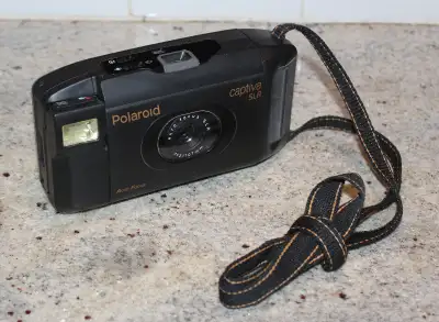 Clean and working Polaroid Captiva Camera., View more