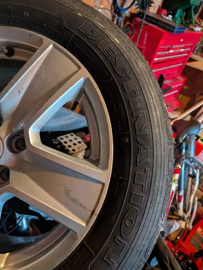I am selling a set of used all-season tires on Jeep rims, size 225/60R17, offering reliable performa...
