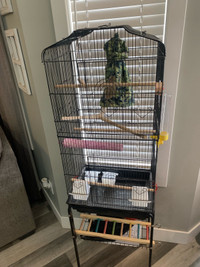 Bird cage on roller stand. 