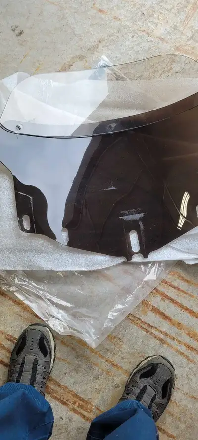 Tinted windshield with extra tall clear piece. Which can be removed, lowered,used. And bolt on rack...