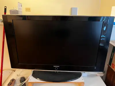 Samsung  TV with TV stand, View more