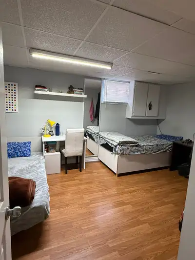 Two spacious, private rooms are available for rent in a clean basement apartment located near Kenned...