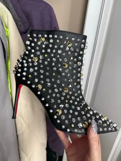 Step out in style with these edgy Christian Louboutin So Kate-2018 studded ankle boots. These boots...