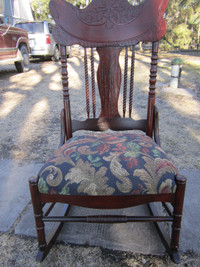 Antique pressed back rocking chair