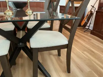 4 dark wood solid wood dining chairs, beige upholstered seats,, View more