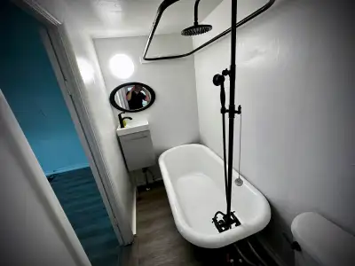 This unit is a fully renovated two-story, one-bedroom, one-bathroom unit with a front porch and stor...