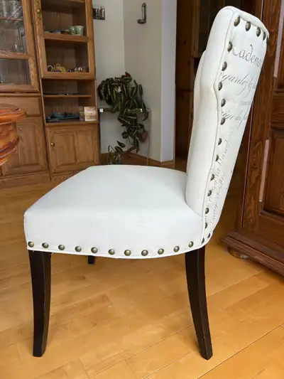 Selling this reupholstered accent chair with French lettering on the back Back of chair measures 19”...