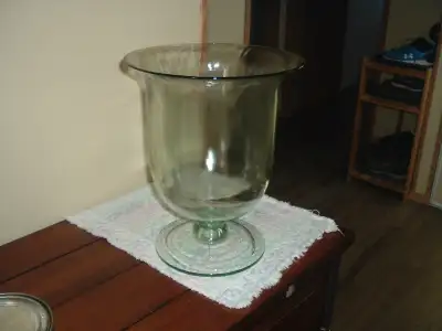 Very large glass vase. 12" or 1' in height. Can set on floor or table. Use it for pretty much anythi...